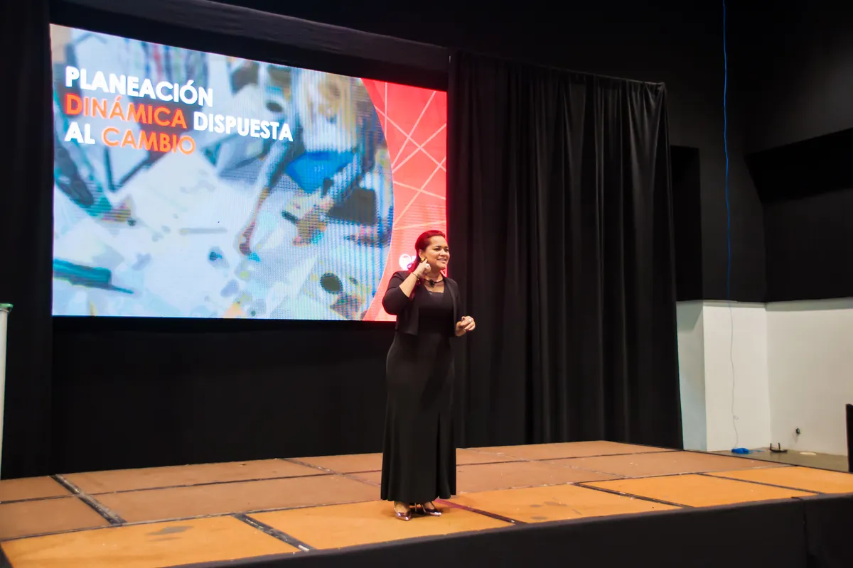 Kenelva Castrillón on stage during a keynote