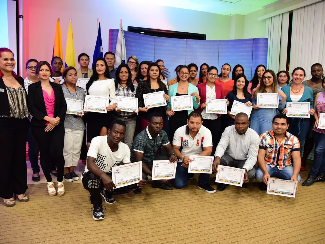 A group of participants holding their training certificates